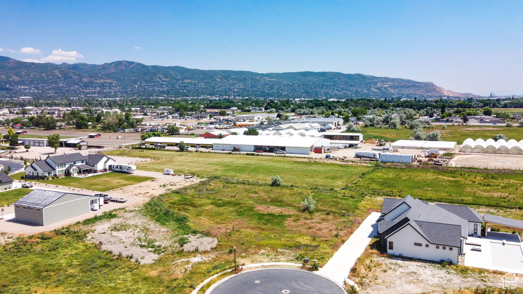 Birds eye view of property with a mountain view