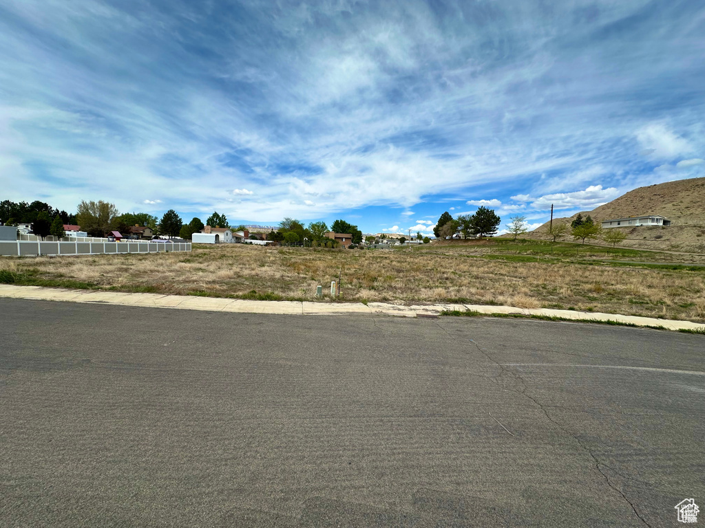 View of yard with a rural view