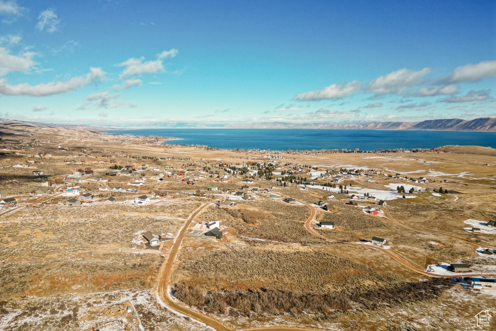 Drone / aerial view with a water and mountain view