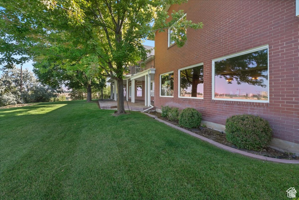Exterior space featuring a lawn