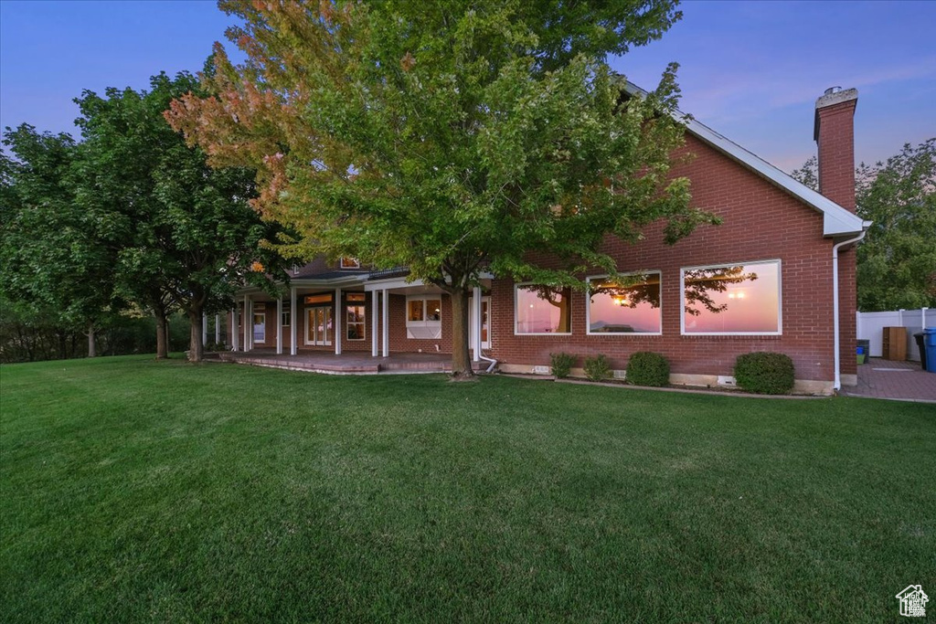 View of front of home featuring a yard