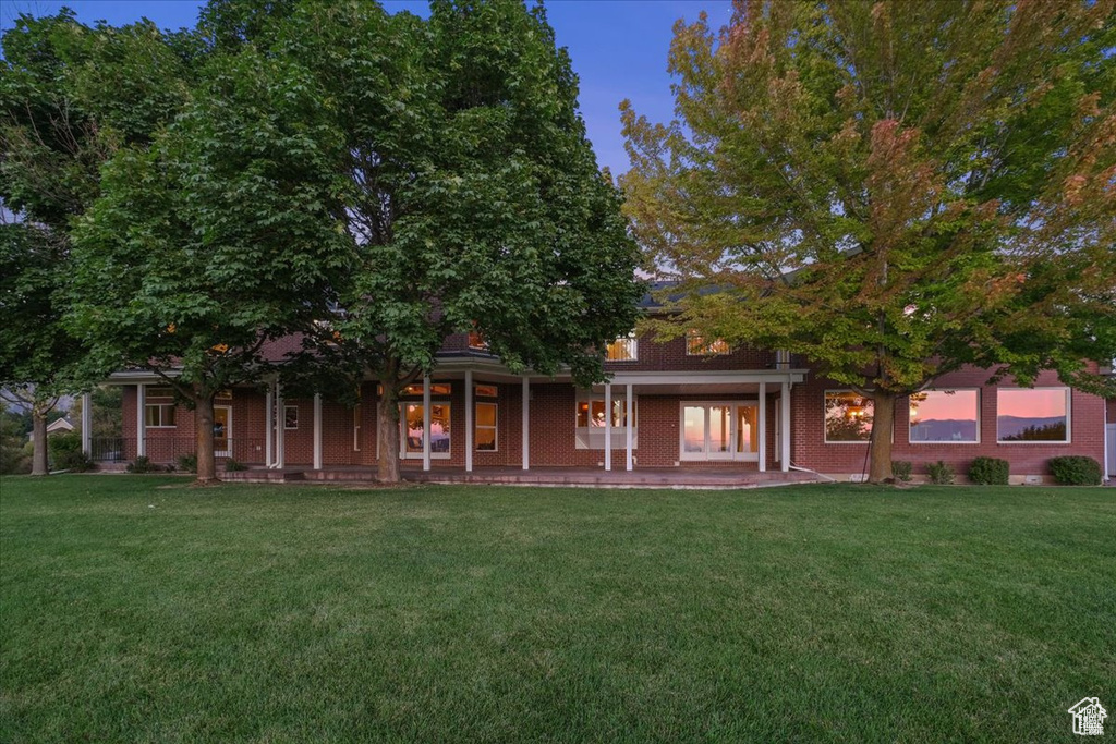 Obstructed view of property featuring a lawn