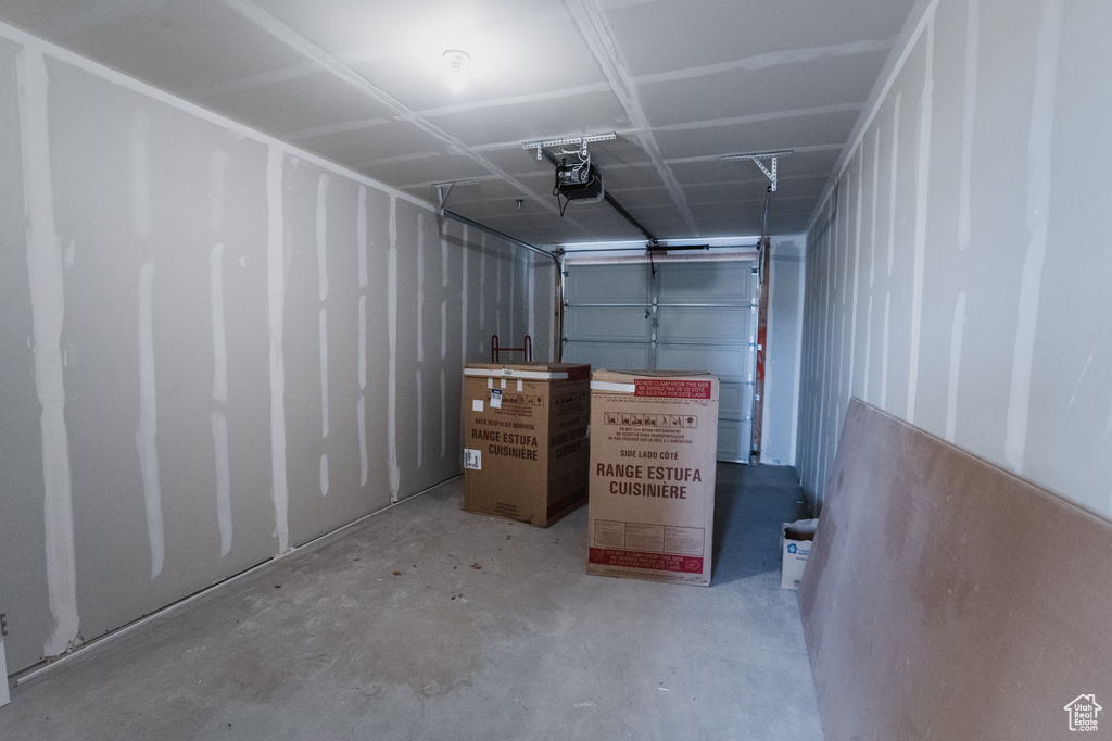 Garage featuring a garage door opener