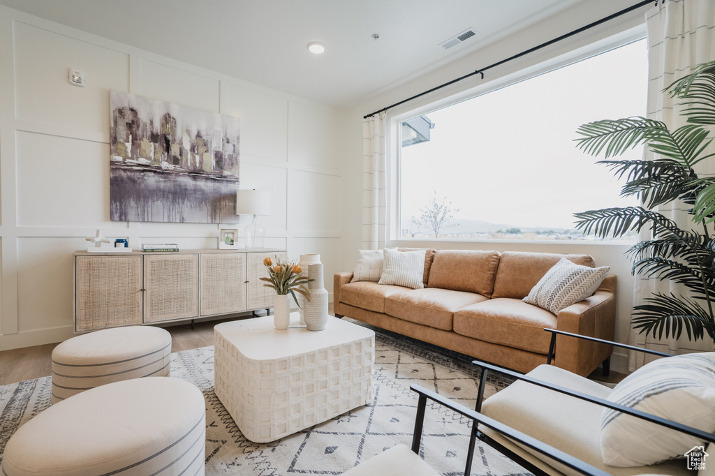 Living room with light hardwood / wood-style floors