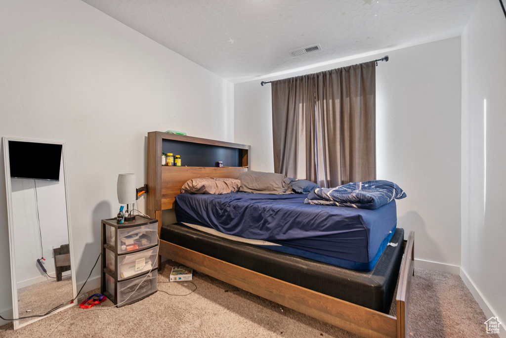 Bedroom featuring carpet