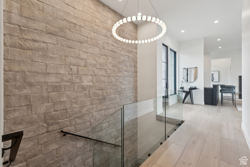 Hall with recessed lighting, baseboards, and wood finished floors
