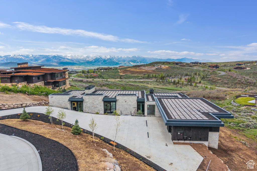 View of subject property with a mountainous background