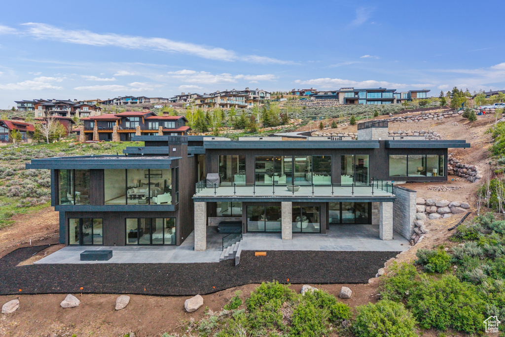 Rear view of property featuring a patio