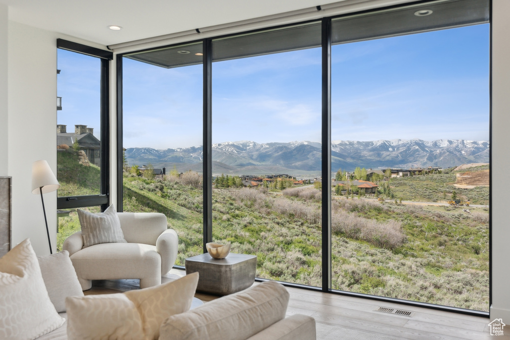 Sunroom featuring a mountain view and plenty of natural light
