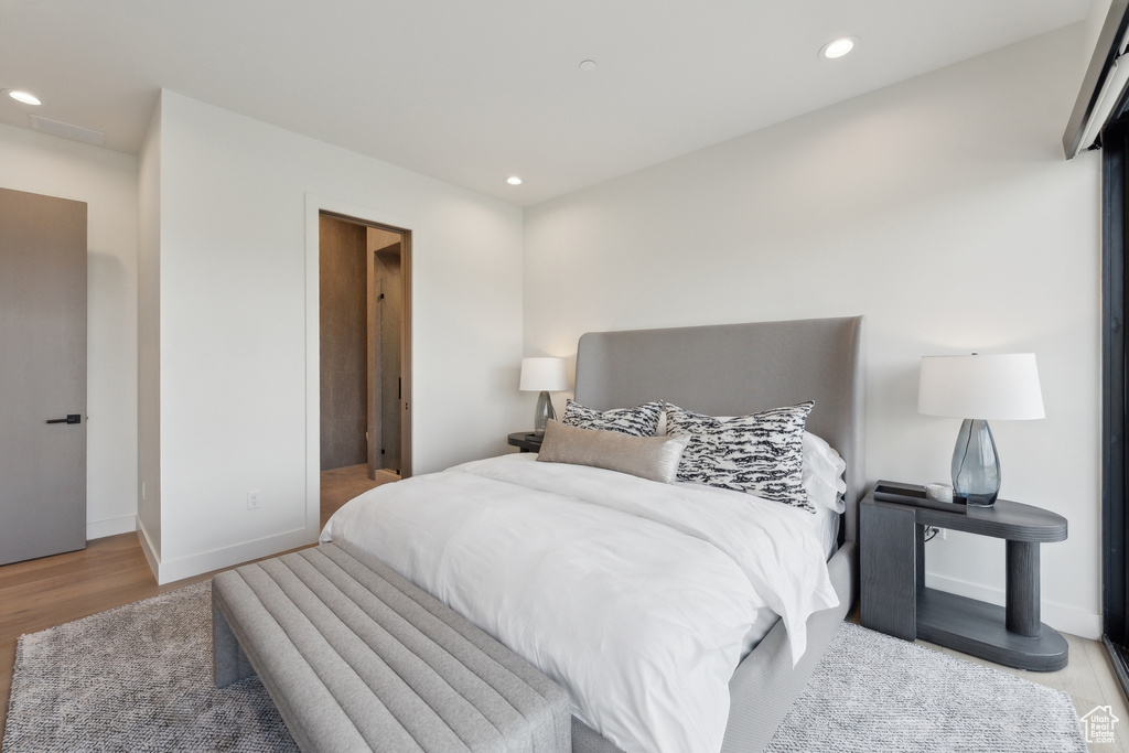 Bedroom featuring recessed lighting, wood finished floors, and baseboards