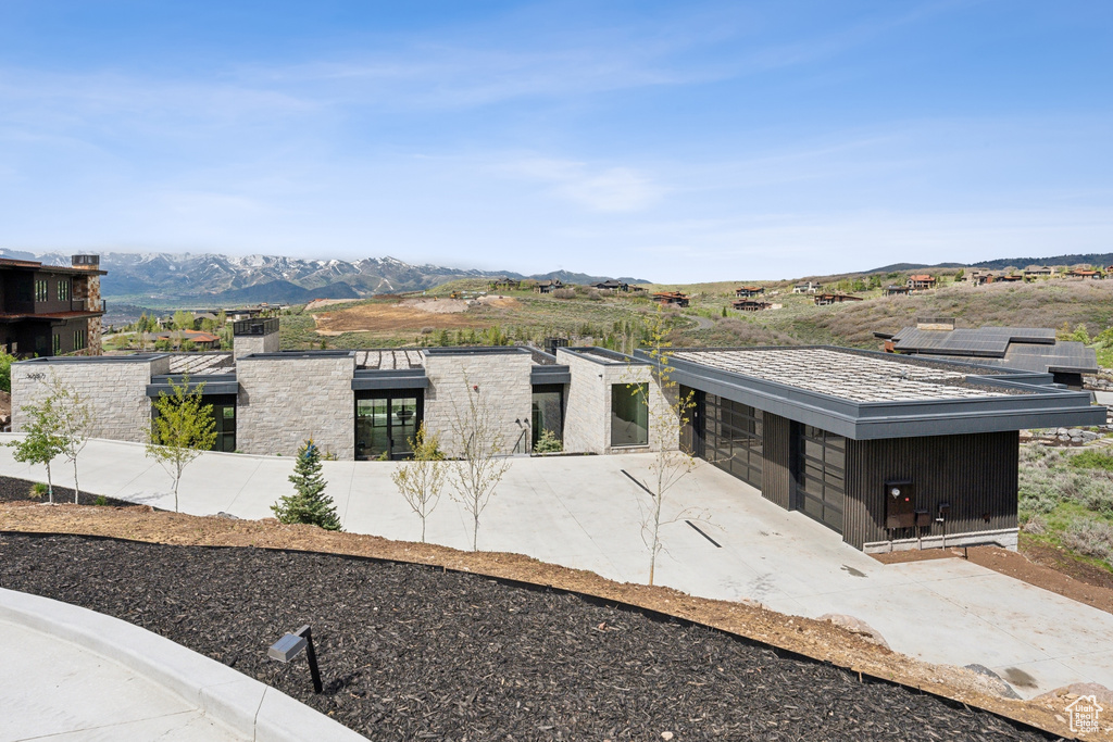 View of front of home with a mountain view