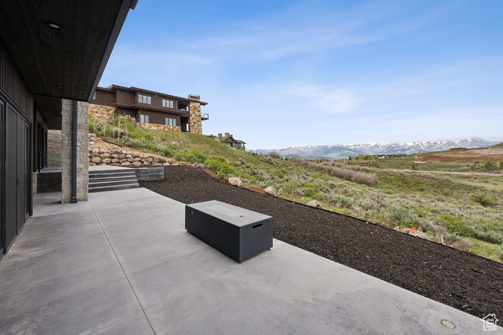 View of patio / terrace with a mountain view