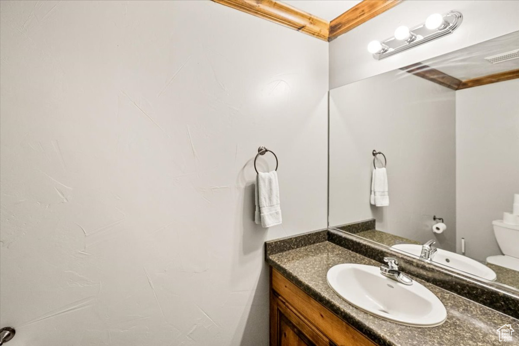 Bathroom with vanity and toilet