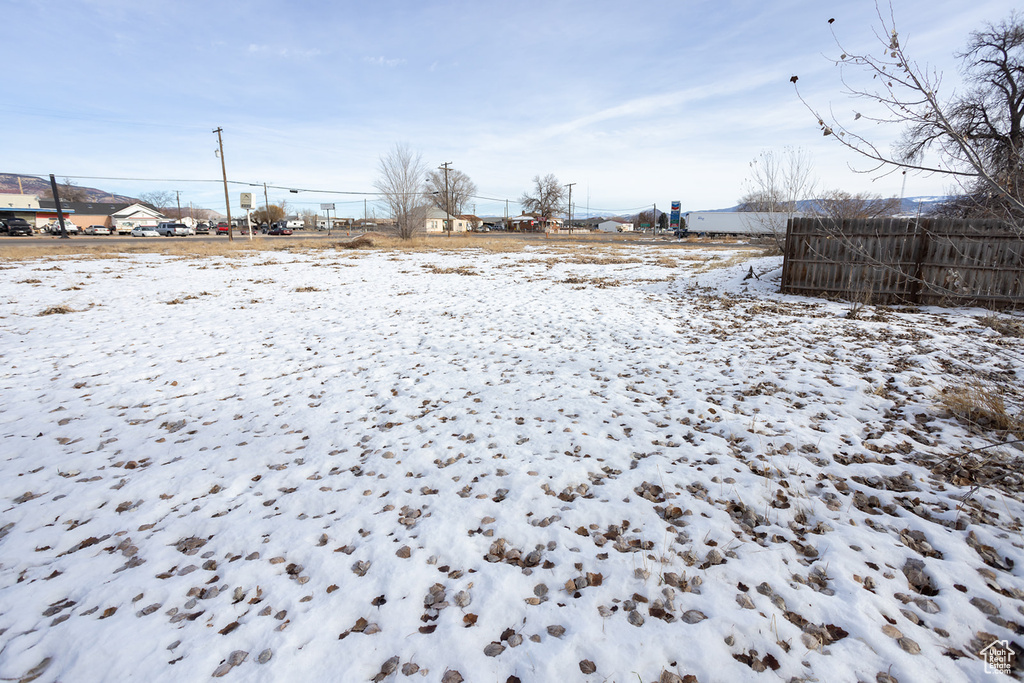 View of yard covered in snow