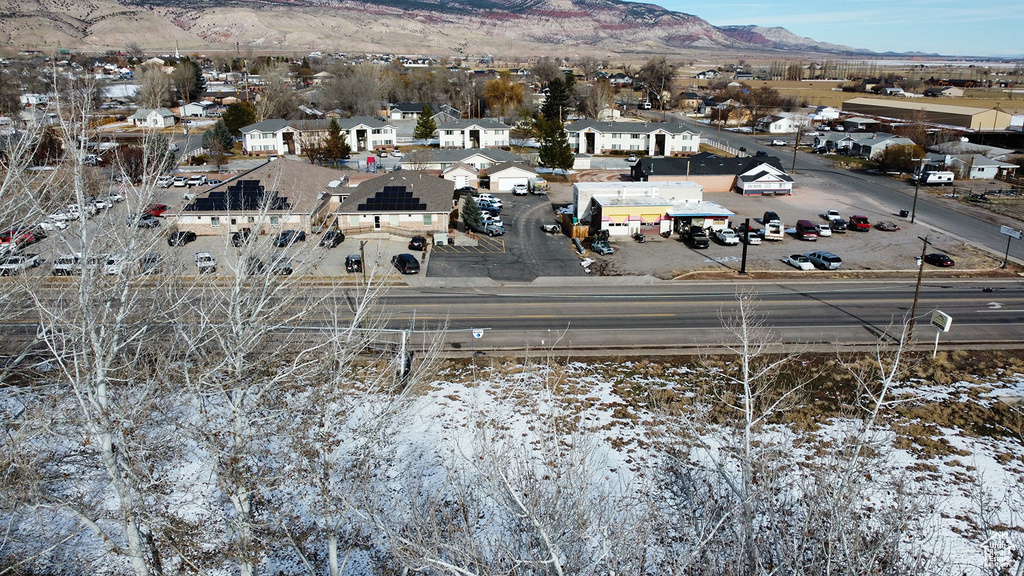 Snowy aerial view featuring a mountain view