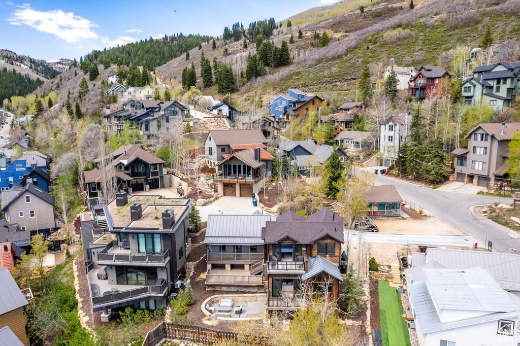 Aerial view of residential area featuring a mountainous background