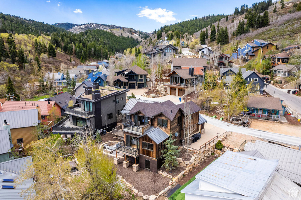 Aerial view of residential area featuring a mountain backdrop