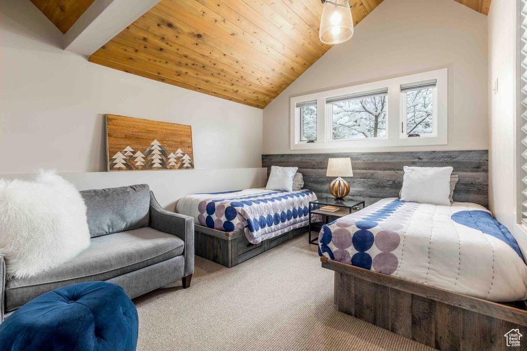 Bedroom featuring carpet floors, lofted ceiling, and wooden ceiling