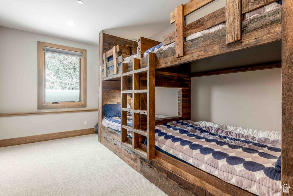 Carpeted bedroom featuring recessed lighting and baseboards