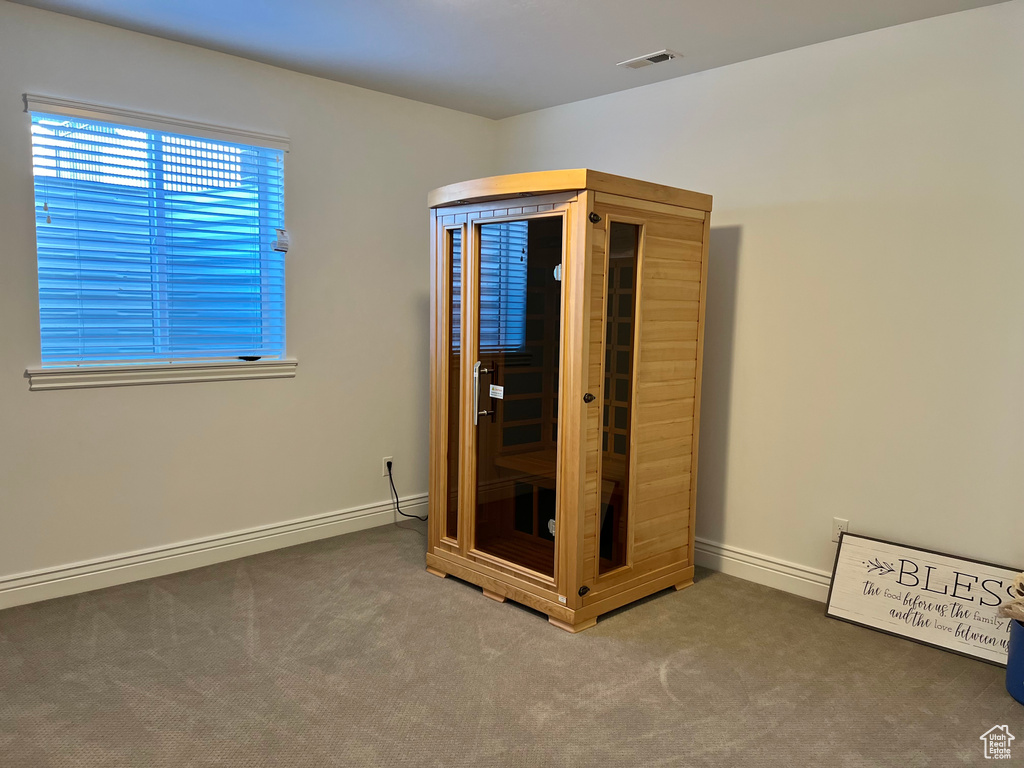 Unfurnished bedroom with carpet flooring