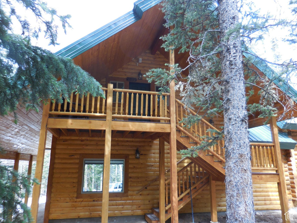 View of home's exterior with a balcony