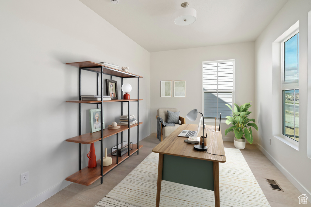 Office area featuring light wood finished floors and baseboards