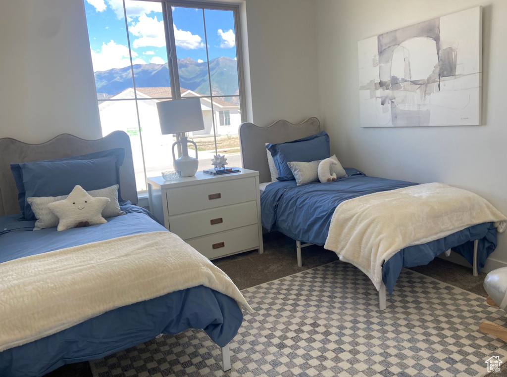 Bedroom featuring a mountain view and carpet floors