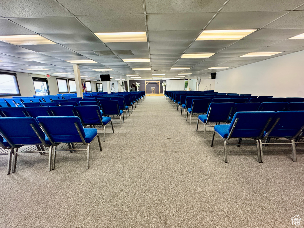 Miscellaneous room featuring carpet and a paneled ceiling