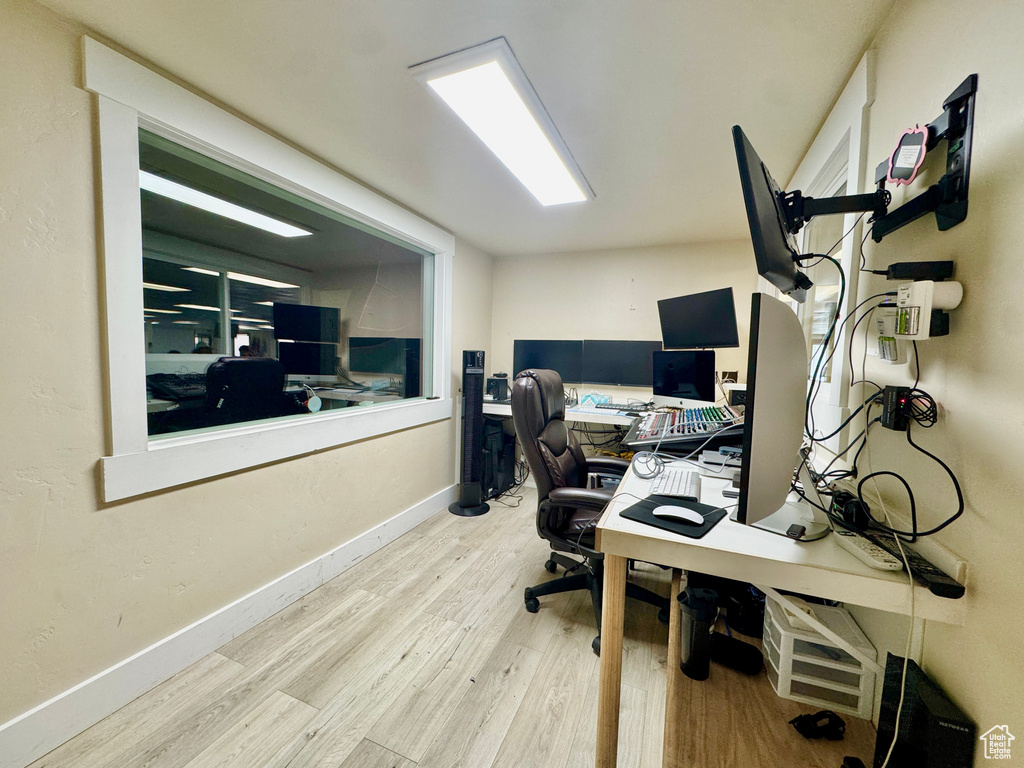 Office featuring wood finished floors and baseboards
