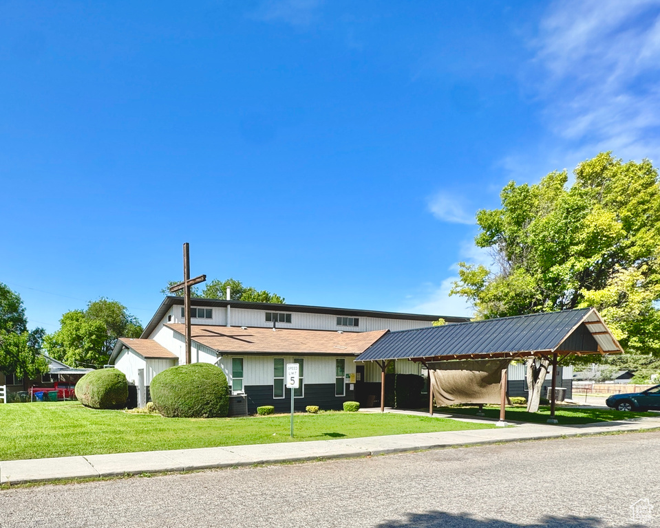 View of front of property with a front lawn