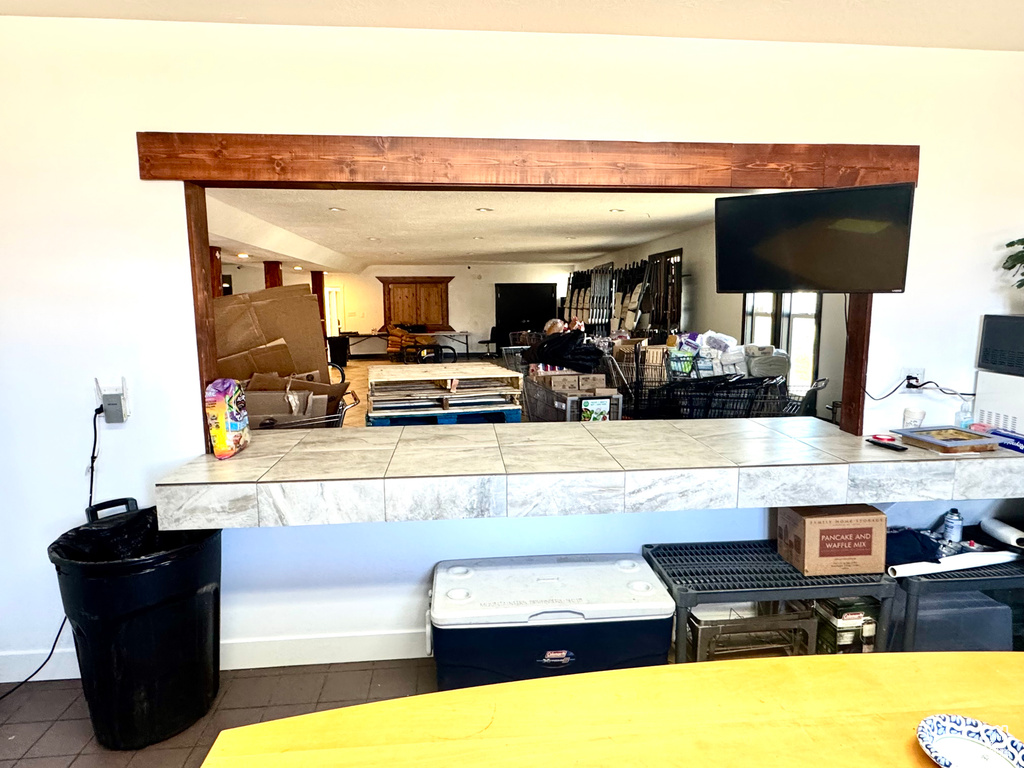 Kitchen with tile countertops and tile patterned floors