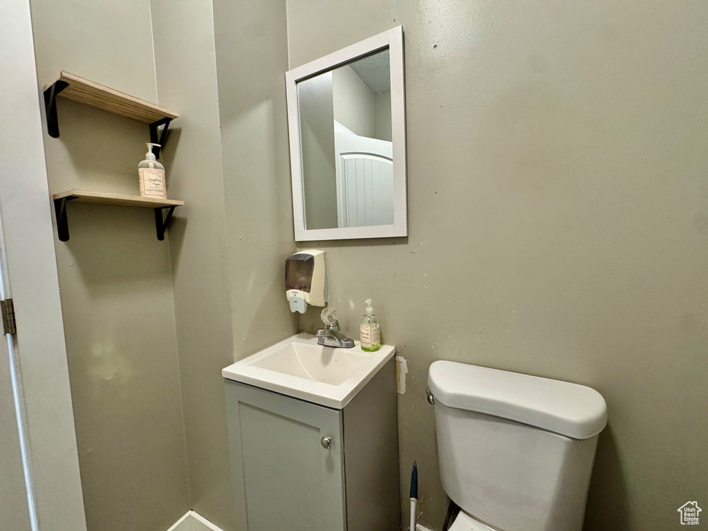 Bathroom featuring vanity and toilet
