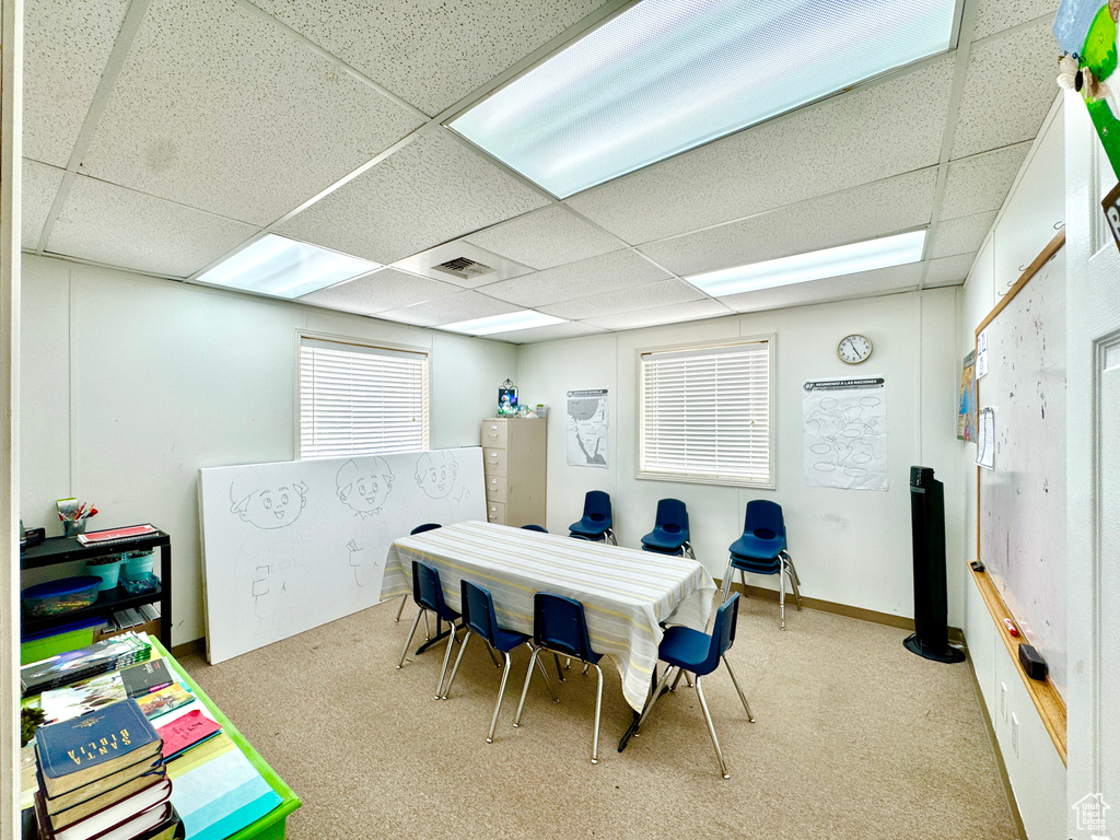 Game room with a drop ceiling and carpet