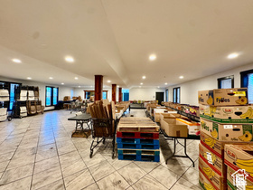 Tiled dining room with recessed lighting
