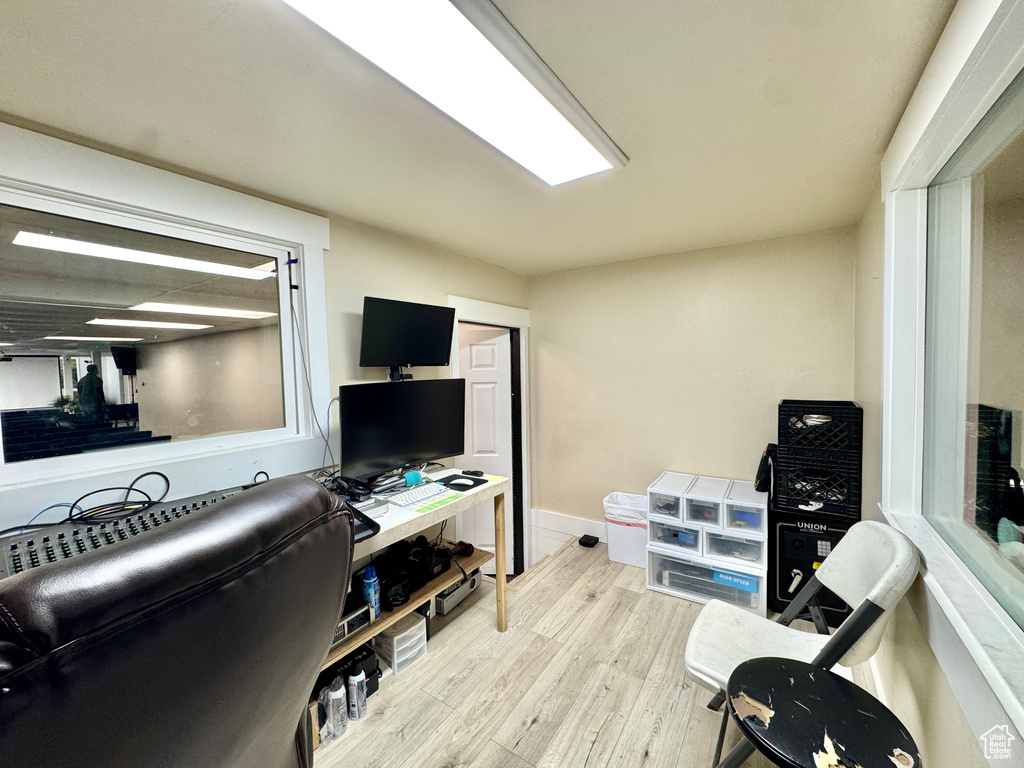 Office with wood finished floors and baseboards