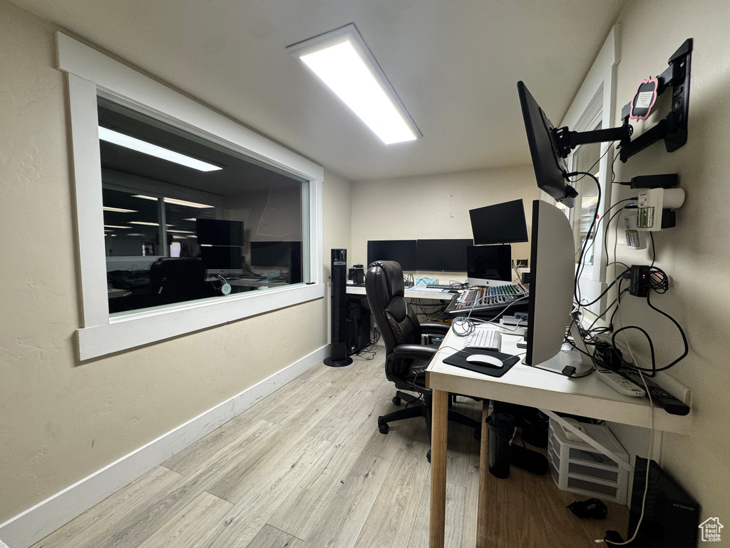 Office space featuring wood finished floors and baseboards