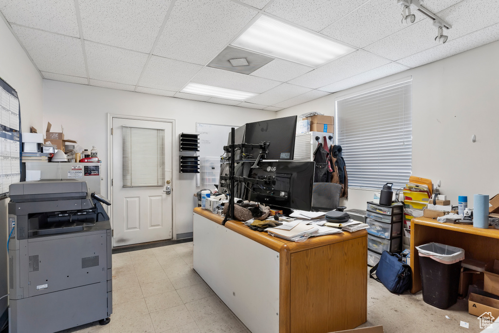 Home office featuring a drop ceiling