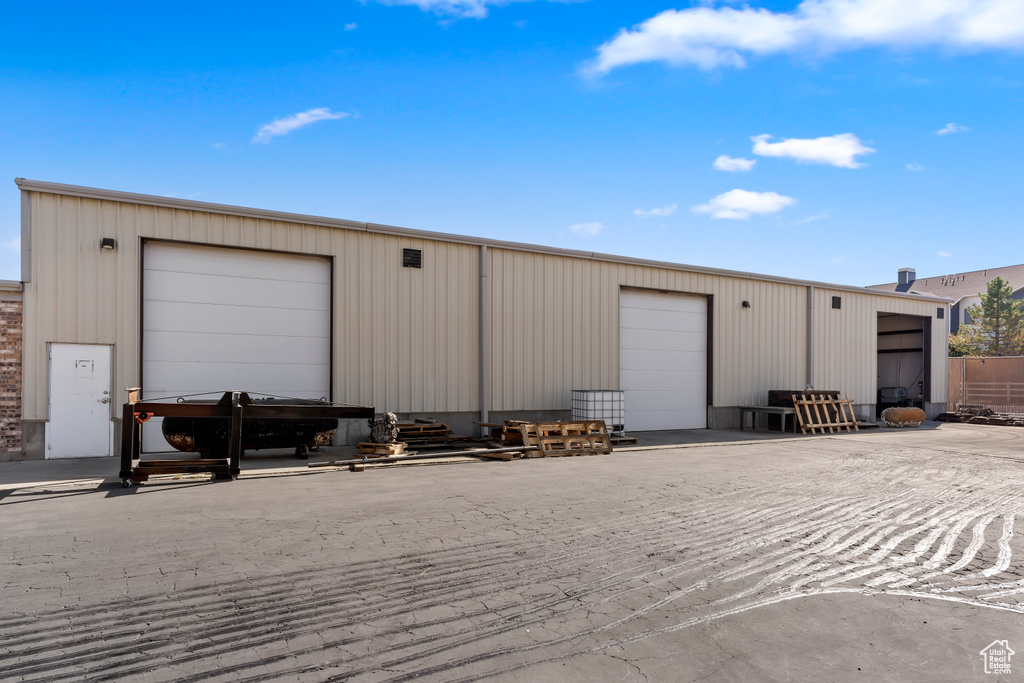 View of outdoor structure featuring a garage