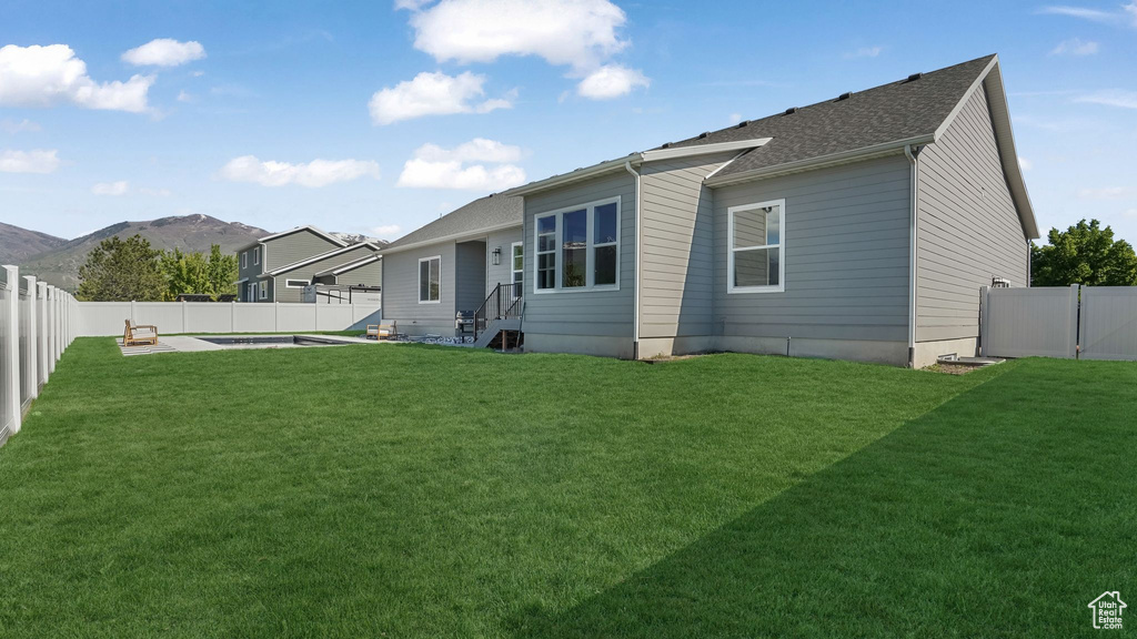 Rear view of property with a mountain view
