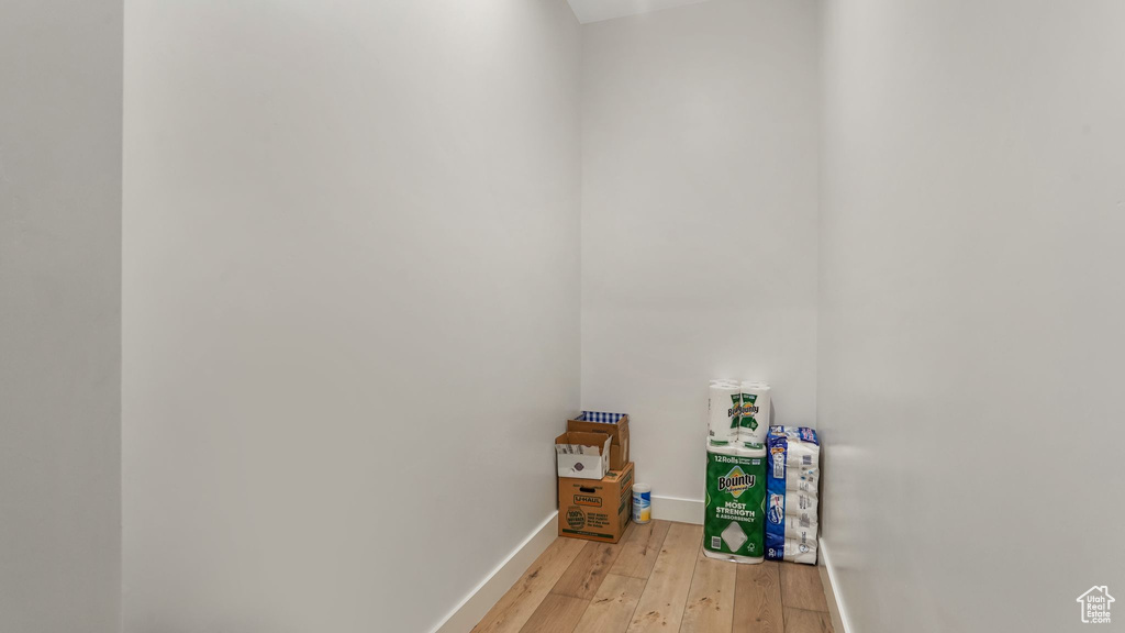 Washroom featuring light wood-style floors and baseboards