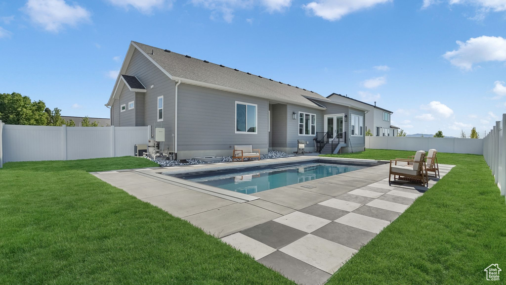 Back of property featuring a patio area and french doors