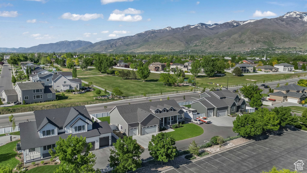 Aerial perspective of suburban area with a mountainous background