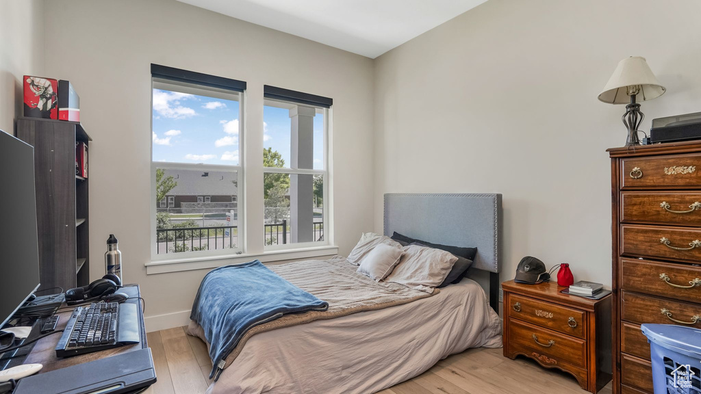 Bedroom with light wood-style flooring