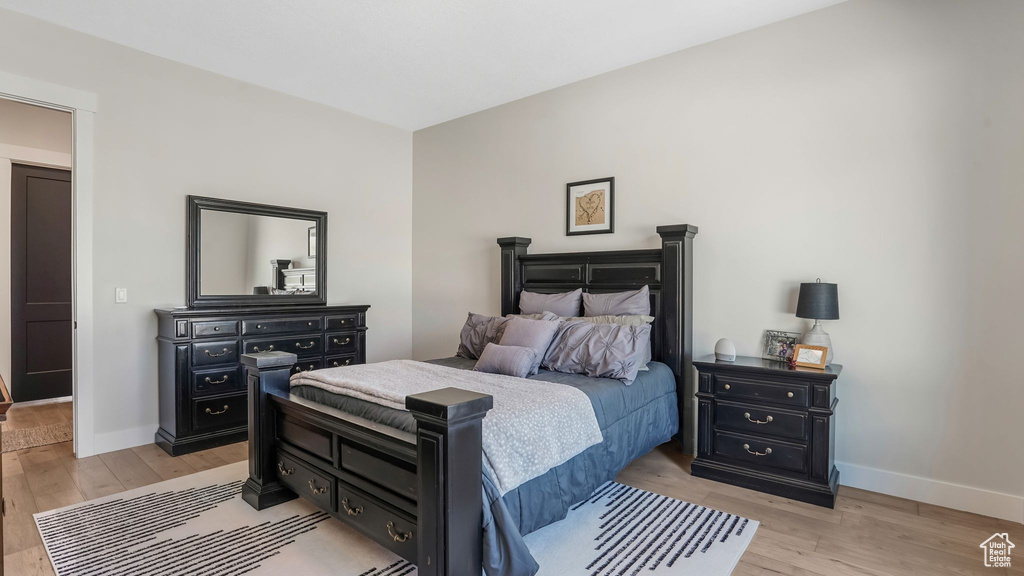 Bedroom featuring baseboards and light wood-type flooring