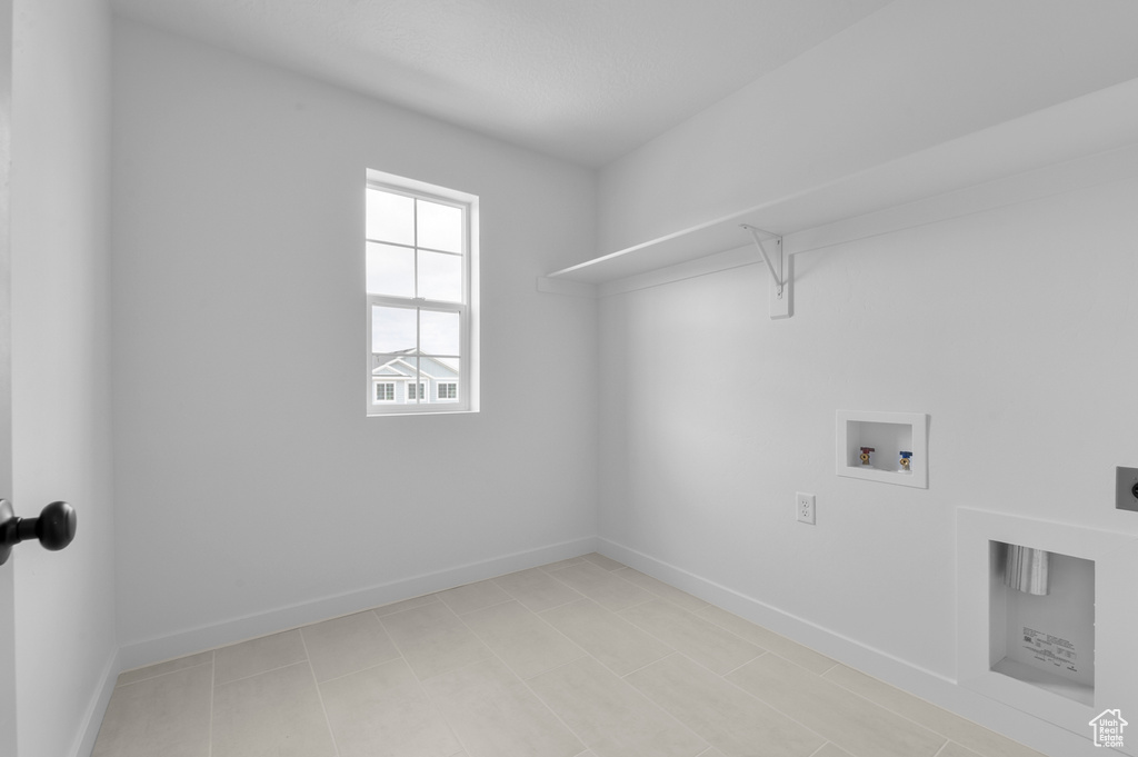 Laundry area featuring hookup for an electric dryer, washer hookup, and baseboards