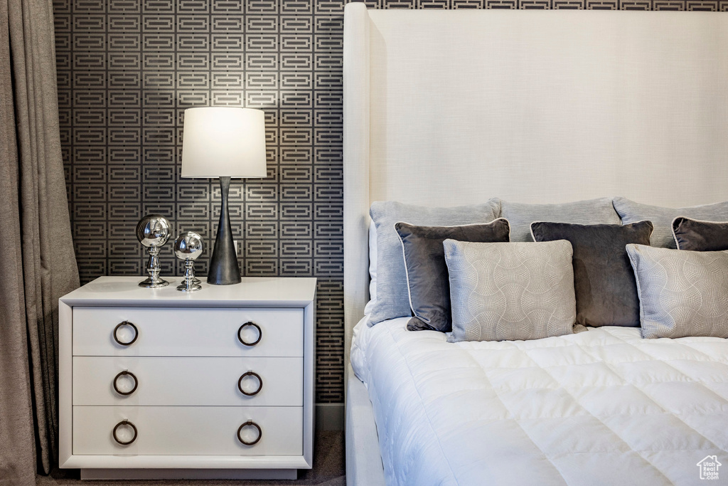 Bedroom with wallpapered walls
