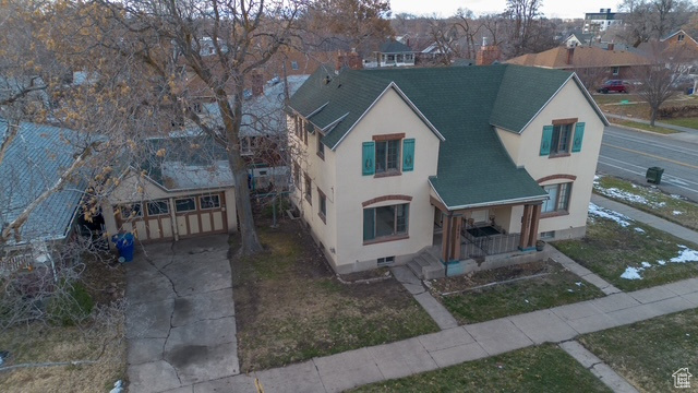 View of front of home featuring a porch and a garage