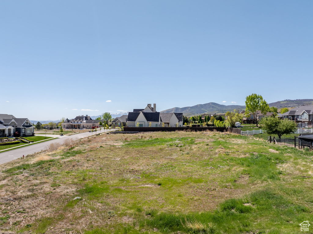 View of yard featuring a residential view and a mountain view