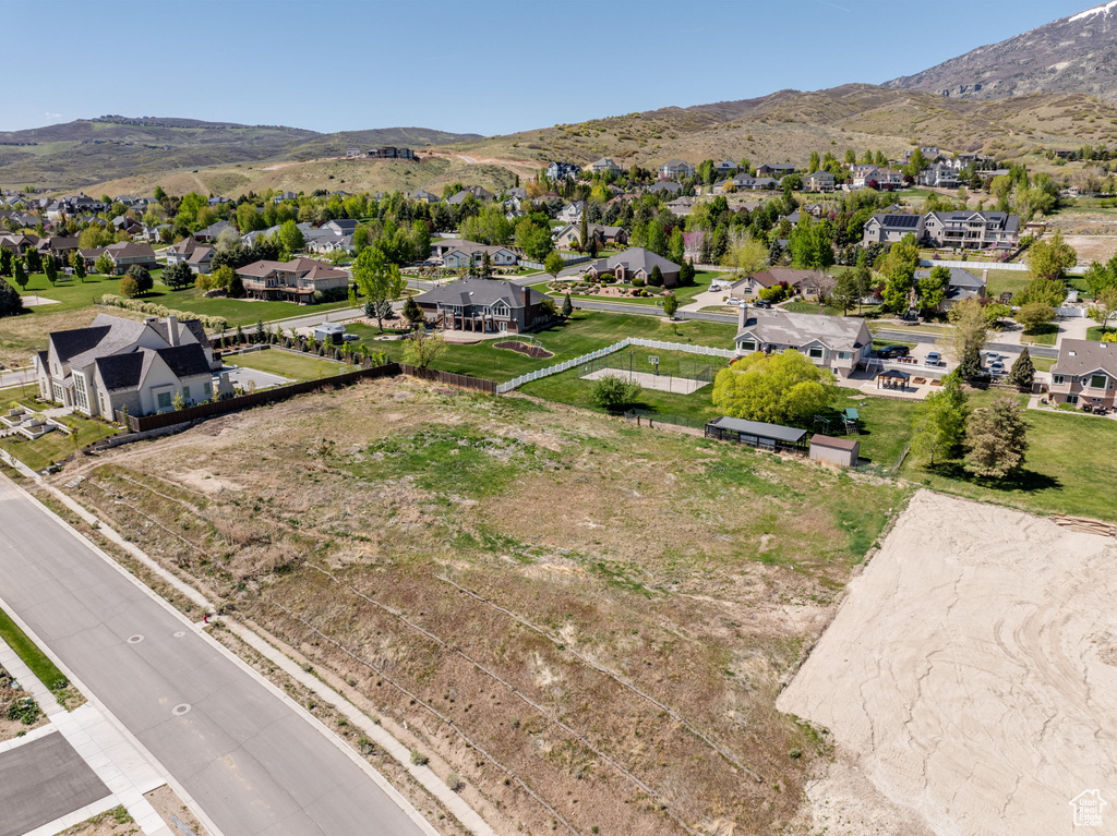 Aerial perspective of suburban area with a mountain backdrop
