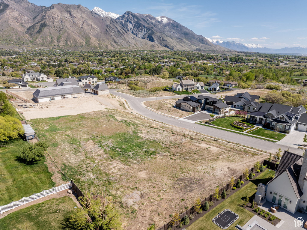 Aerial view of residential area featuring mountains
